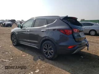✅ 2018 Hyundai Santa Fe Ultimate • VIN: 5XYZW4LAXJG529226 • Лот: 64885923. Опубликован ранее на Copart с пробегом Не указан. Бесплатный доступ к архиву аукционных продаж из США и подробный отчёт об истории автомобиля на DreamBid. Изображение 2.