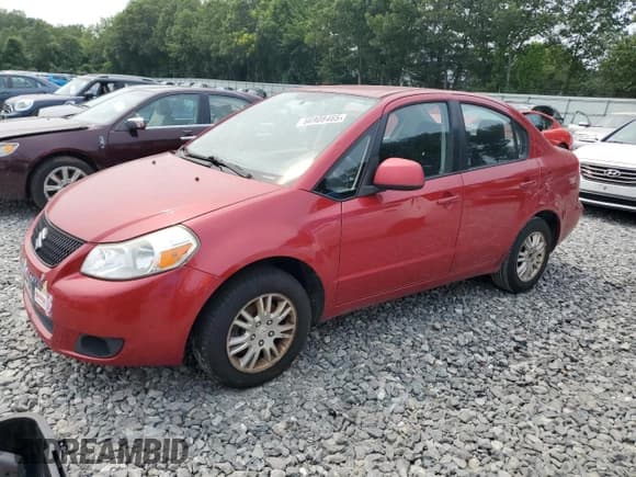 ✅ 2012 Suzuki SX4 LE • VIN: JS2YC5A32C6301179 • Lot: 66908465. Listed on Copart with 189,822 mi. Free auction sales archive from the USA and detailed vehicle history report at DreamBid. Image 1.