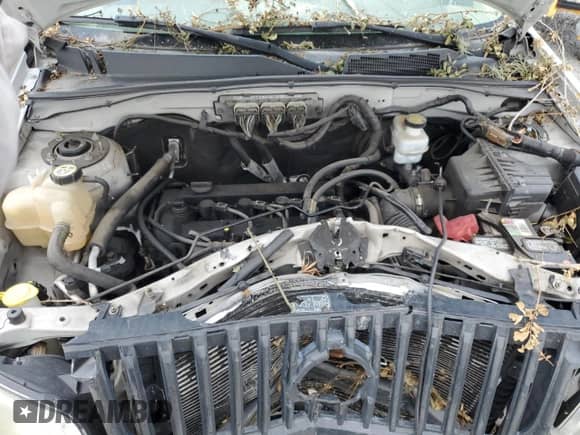 2009 Mercury Mariner Premier with VIN 4M2CU87709KJ14823, listed as a Copart auction lot 60121965 with Not provided miles and Salvage title. Bid and sale history available at DreamBid. Image 12.