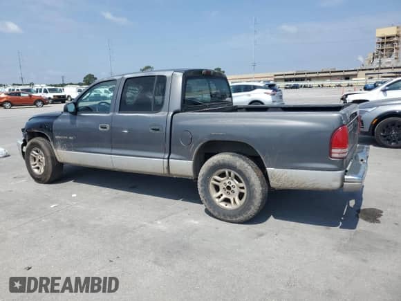 2002 Dodge Dakota SLT z VIN 1B7HL48X52S688636, wystawiony jako Copart lot #53062325 z przebiegiem 224 011 mil mil oraz Szkoda całkowita • Salvage title. Historia ofert i sprzedaży dostępna na DreamBid. Obrazek 2.