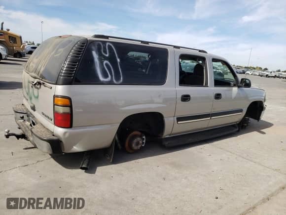 2004 Chevrolet Suburban LS с VIN 1GNEC16T54J184718, выставлен на аукционе Copart как лот 74020304 с пробегом Не указан миль и Списание • Salvage title. История ставок и продаж доступна на DreamBid. Изображение 3.