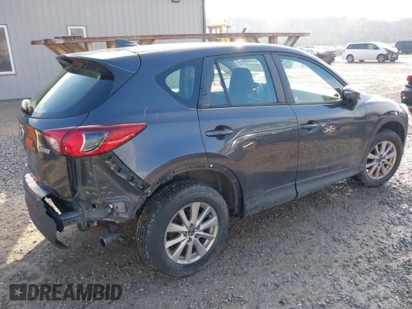 ✅ 2016 Mazda CX-5 Sport • VIN: JM3KE4BY9G0784667 • Lot: 43737851. Listed on IAAI with 151,569 mi. Free auction sales archive from the USA and detailed vehicle history report at DreamBid. Image 4.