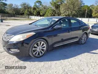 2013 Hyundai Azera z VIN KMHFH4JG4DA269426, wystawiony jako Copart lot #87641235 z przebiegiem 113 533 mil mil oraz Szkoda całkowita • Salvage title. Historia ofert i sprzedaży dostępna na DreamBid. Obrazek 1.