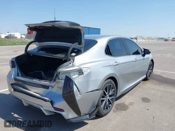 2021 Toyota Camry Hybrid SE z VIN 4T1G31AKXMU562641, wystawiony jako IAAI lot #42415712 z przebiegiem 71 085 mil mil oraz . Historia ofert i sprzedaży dostępna na DreamBid. Obrazek 4.