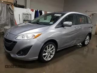 ✅ 2015 Mazda 5 Grand Touring • VIN: JM1CW2DL9F0181734 • Lot: 85604134. Listed on Copart with 136,917 mi. Free auction sales archive from the USA and detailed vehicle history report at DreamBid. Image 1.