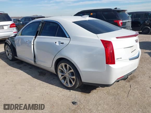 ✅ 2015 Cadillac ATS Performance RWD • VIN: 1G6AC5SX4F0113027 • Лот: 41307410. Опубликован ранее на IAAI с пробегом 125 336 миль. Бесплатный доступ к архиву аукционных продаж из США и подробный отчёт об истории автомобиля на DreamBid. Изображение 3.