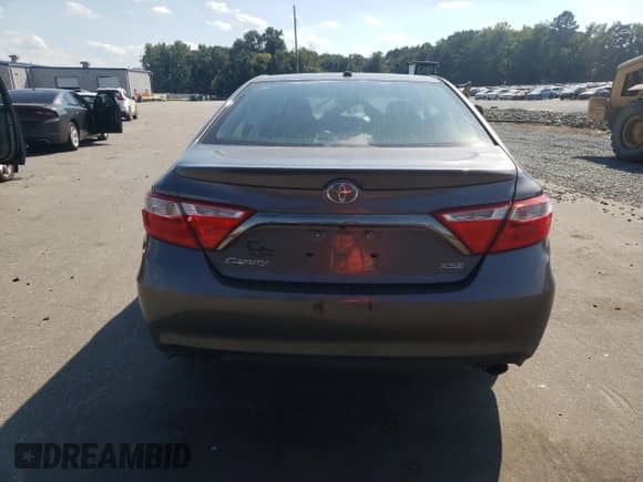 2015 Toyota Camry LE with VIN 4T1BF1FK2FU879326, listed as a Copart auction lot 71708635 with 128,243 mi miles and Salvage title. Bid and sale history available at DreamBid. Image 6.