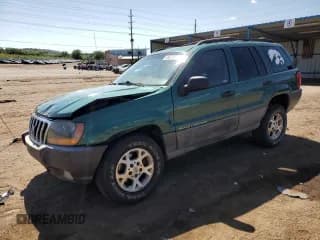 ✅ 1999 Jeep Grand Cherokee Laredo • VIN: 1J4GW58S7XC568362 • Lot: 58078175. Listed on Copart with 148,369 mi. Free auction sales archive from the USA and detailed vehicle history report at DreamBid. Image 1.