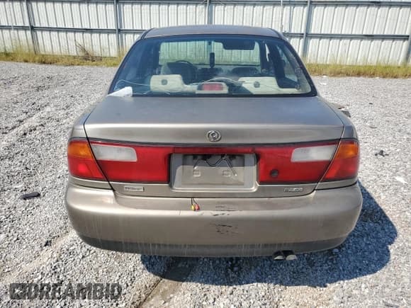 ✅ 1997 Mazda Protege DX • VIN: JM1BC1416V0145687 • Lot: 81469525. Wystawiony na Copart z przebiegiem 277 313 mil. Bezpłatny archiwum sprzedaży aukcyjnych z USA i szczegółowy raport historii pojazdu na DreamBid. Zdjęcie 6.