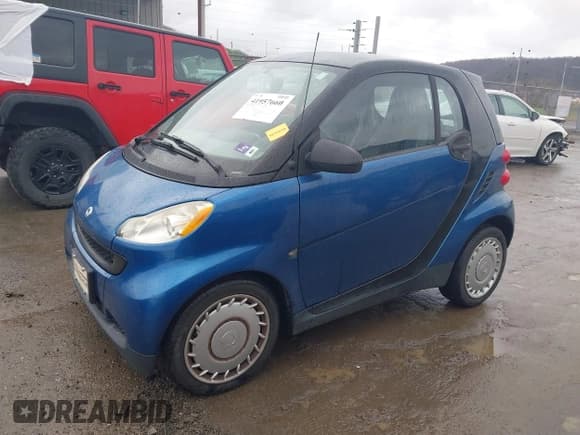 ✅ 2009 Smart fortwo Pure • VIN: WMEEJ31X69K312553 • Lot: 41957660. Listed on IAAI with 156,476 mi. Free auction sales archive from the USA and detailed vehicle history report at DreamBid. Image 2.
