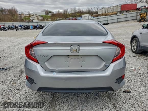 ✅ 2018 Honda Civic LX • VIN: 19XFC2F5XJE027537 • Лот: 94306525. Опубликован ранее на Copart с пробегом 104 457 миль. Бесплатный доступ к архиву аукционных продаж из США и подробный отчёт об истории автомобиля на DreamBid. Изображение 6.