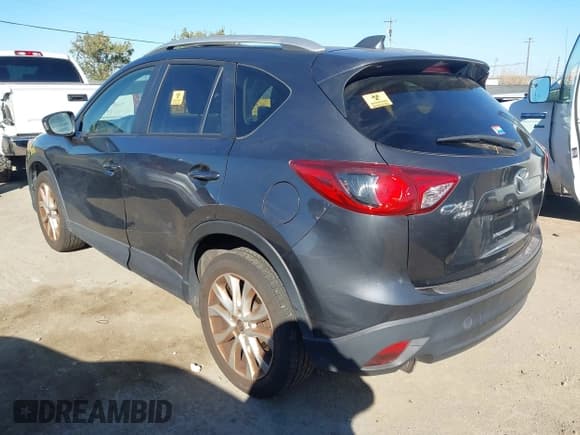 ✅ 2014 Mazda CX-5 Grand Touring • VIN: JM3KE4DY0E0355217 • Lot: 43433154. Listed on IAAI with 166,232 mi. Free auction sales archive from the USA and detailed vehicle history report at DreamBid. Image 3.