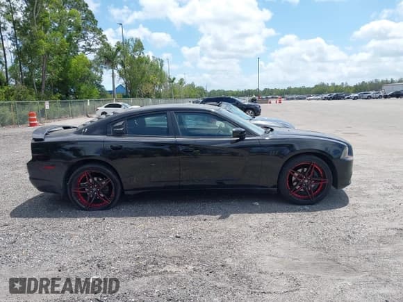✅ 2013 Dodge Charger SXT Plus • VIN: 2C3CDXJG1DH584579 • Lot: 42128401. Listed on IAAI with 100,388 mi. Free auction sales archive from the USA and detailed vehicle history report at DreamBid. Image 13.