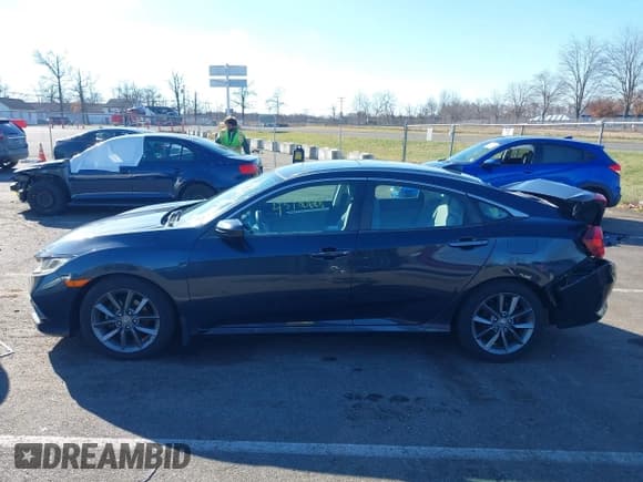 ✅ 2019 Honda Civic EX • VIN: 19XFC1F34KE204349 • Lot: 43780668. Listed on IAAI with 70,089 mi. Free auction sales archive from the USA and detailed vehicle history report at DreamBid. Image 14.