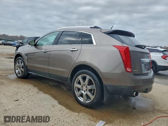 ✅ 2012 Cadillac SRX Performance Collection • VIN: 3GYFNBE37CS532590 • Lot: 94237585. Listed on Copart with 166,412 mi. Free auction sales archive from the USA and detailed vehicle history report at DreamBid. Image 2.