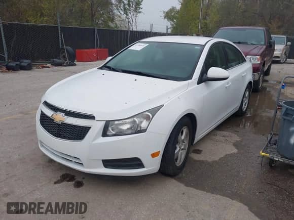 2014 Chevrolet Cruze 1LT with VIN 1G1PC5SB5E7312954, listed as a IAAI auction lot 43586516 with 151,548 mi miles and . Bid and sale history available at DreamBid. Image 2.