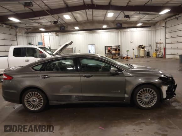✅ 2014 Ford Fusion Titanium Hybrid • VIN: 3FA6P0RU1ER217906 • Lot: 42563246. Listed on IAAI with 66,335 mi. Free auction sales archive from the USA and detailed vehicle history report at DreamBid. Image 14.