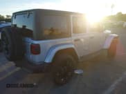 ✅ 2023 Jeep Wrangler Sahara • VIN: 1C4JJXP65PW630477 • Lot: 43864711. Listed on IAAI with 10,033 mi. Free auction sales archive from the USA and detailed vehicle history report at DreamBid. Image 4.