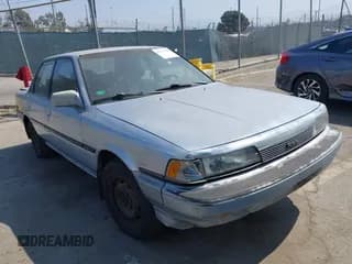✅ 1988 Toyota Camry LE • VIN: JT2SV22EXJ3305934 • Lot: 42737343. Listed on IAAI with 256,096 mi. Free auction sales archive from the USA and detailed vehicle history report at DreamBid. Image 1.