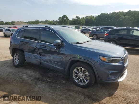 ✅ 2020 Jeep Cherokee Altitude • VIN: 1C4PJLLB4LD653986 • Lot: 66932065. Listed on Copart with 99,629 mi. Free auction sales archive from the USA and detailed vehicle history report at DreamBid. Image 4.