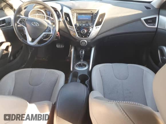 2012 Hyundai Veloster w/Red Int z VIN KMHTC6AD5CU067498, wystawiony jako Copart lot #90810075 z przebiegiem 132 773 mil mil oraz Czysty tytuł • Clean title. Historia ofert i sprzedaży dostępna na DreamBid. Obrazek 8.