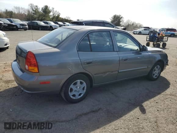 2005 Hyundai Accent GLS z VIN KMHCG45C65U625887, wystawiony jako Copart lot #48824225 z przebiegiem 110 594 mil mil oraz Szkoda całkowita • Salvage title. Historia ofert i sprzedaży dostępna na DreamBid. Obrazek 3.