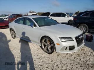 ✅ 2014 Audi RS 7 Prestige • VIN: WUAW2AFC8EN903795 • Лот: 77409074. Опубликован ранее на Copart с пробегом Не указан. Бесплатный доступ к архиву аукционных продаж из США и подробный отчёт об истории автомобиля на DreamBid. Изображение 4.