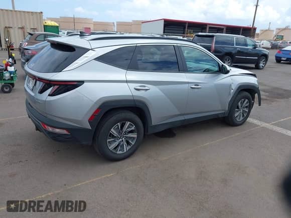 2023 Hyundai Tucson Blue z VIN KM8JBCA16PU097422, wystawiony jako IAAI lot #42138545 z przebiegiem 14 826 mil mil oraz . Historia ofert i sprzedaży dostępna na DreamBid. Obrazek 4.