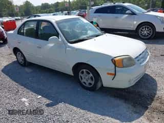 2005 Hyundai Accent GLS z VIN KMHCG45C35U641013, wystawiony jako IAAI lot #43015581 z przebiegiem 158 018 mil mil oraz . Historia ofert i sprzedaży dostępna na DreamBid. Obrazek 1.