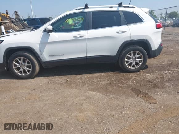 ✅ 2016 Jeep Cherokee Latitude • VIN: 1C4PJMCB6GW246204 • Lot: 42757759. Listed on IAAI with 209,552 mi. Free auction sales archive from the USA and detailed vehicle history report at DreamBid. Image 14.