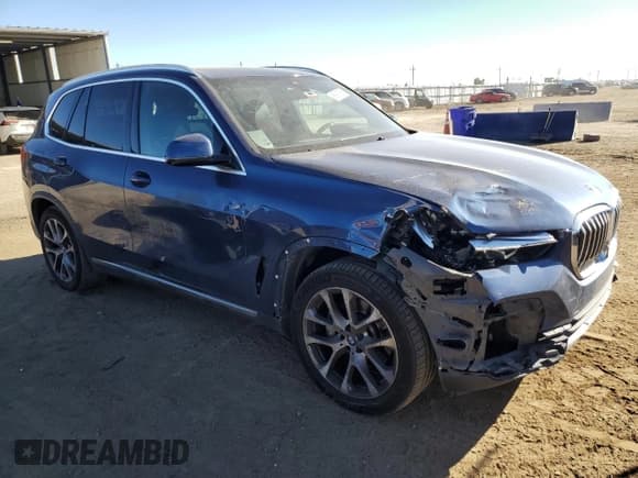 ✅ 2022 BMW X5 xDrive40i • VIN: 5UXCR6C0XN9K60795 • Lot: 89917555. Listed on Copart with 61,864 mi. Free auction sales archive from the USA and detailed vehicle history report at DreamBid. Image 4.