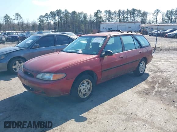 ✅ 1997 Ford Escort • VIN: 1FALP15P4VW104389 • Lot: 41510223. Listed on IAAI with 84,970 mi. Free auction sales archive from the USA and detailed vehicle history report at DreamBid. Image 2.