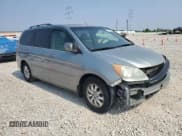 ✅ 2010 Honda Odyssey EX-L • VIN: 5FNRL3H74AB034608 • Lot: 59262505. Listed on Copart with 243,186 mi. Free auction sales archive from the USA and detailed vehicle history report at DreamBid. Image 4.