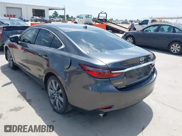 ✅ 2021 Mazda 6 Grand Touring • VIN: JM1GL1TYXM1615684 • Lot: 42690667. Listed on IAAI with 86,360 mi. Free auction sales archive from the USA and detailed vehicle history report at DreamBid. Image 3.