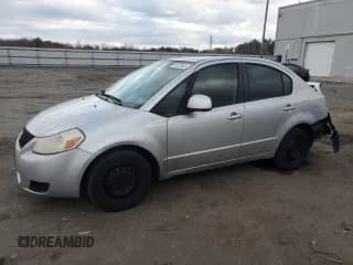 ✅ 2010 Suzuki SX4 LE • VIN: JS2YC5A28A6302731 • Lot: 91470045. Wystawiony na Copart z przebiegiem 160 698 mil. Bezpłatny archiwum sprzedaży aukcyjnych z USA i szczegółowy raport historii pojazdu na DreamBid. Zdjęcie 1.