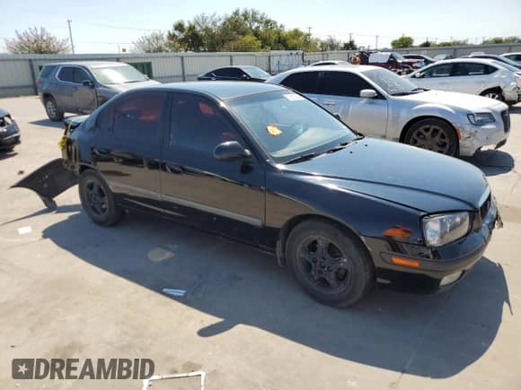 2003 Hyundai Elantra GLS z VIN KMHDN45D43U509474, wystawiony jako Copart lot #71657564 z przebiegiem 346 936 mil mil oraz Szkoda całkowita • Salvage title. Historia ofert i sprzedaży dostępna na DreamBid. Obrazek 4.