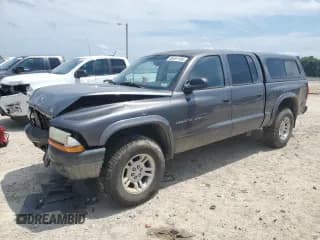✅ 2002 Dodge Dakota Sport • VIN: 1B7HG38N02S584357 • Lot: 66451105. Wystawiony na Copart z przebiegiem 200 297 mil. Bezpłatny archiwum sprzedaży aukcyjnych z USA i szczegółowy raport historii pojazdu na DreamBid. Zdjęcie 1.