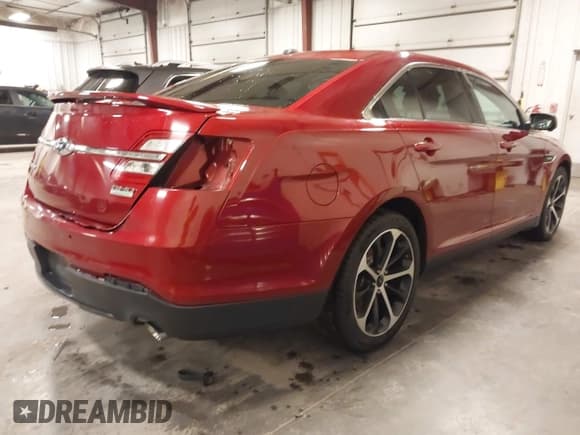 ✅ 2014 Ford Taurus SHO • VIN: 1FAHP2KT9EG130834 • Lot: 41748199. Listed on IAAI with 98,857 mi. Free auction sales archive from the USA and detailed vehicle history report at DreamBid. Image 4.
