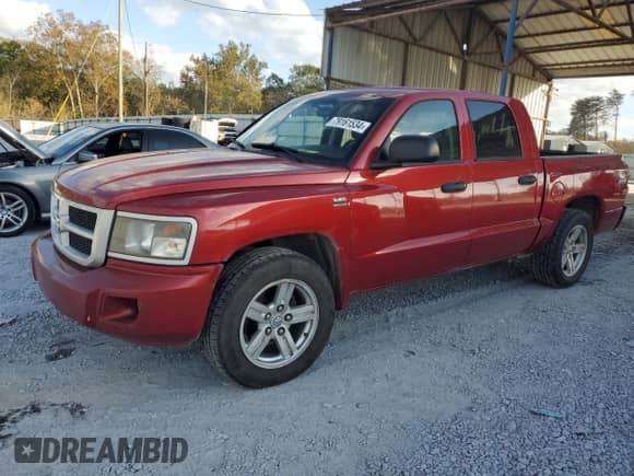 2010 Dodge Dakota SXT with VIN 1D7CW3GP0AS107674, listed as a Copart auction lot 79161534 with 181,681 mi miles and Salvage title. Bid and sale history available at DreamBid. Image 1.