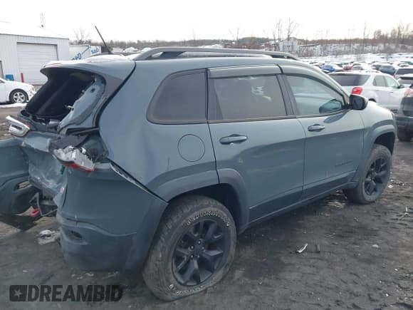 ✅ 2015 Jeep Cherokee Trailhawk • VIN: 1C4PJMBBXFW660456 • Lot: 43841183. Listed on IAAI with 171,261 mi. Free auction sales archive from the USA and detailed vehicle history report at DreamBid. Image 4.