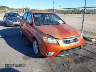 ✅ 2010 Kia Rio LX • VIN: KNADH4A38A6644609 • Lot: 43671723. Listed on IAAI with 109,346 mi. Free auction sales archive from the USA and detailed vehicle history report at DreamBid. Image 1.