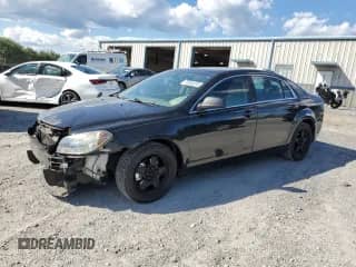 2009 Chevrolet Malibu 1LS with VIN 1G1ZG57BX9F252767, listed as a Copart auction lot 70364215 with 142,185 mi miles and Salvage title. Bid and sale history available at DreamBid. Image 1.