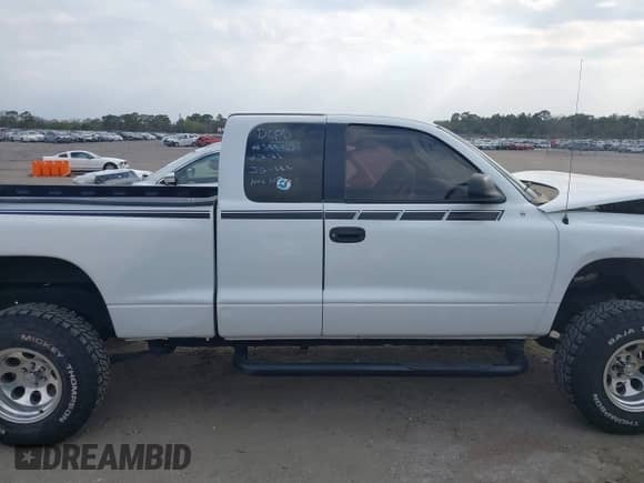 2002 Dodge Dakota Sport z VIN 1B7GL32X22S508401, wystawiony jako IAAI lot #41591465 z przebiegiem Nie podano mil oraz . Historia ofert i sprzedaży dostępna na DreamBid. Obrazek 13.