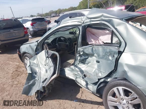 ✅ 2009 Ford Fusion SEL • VIN: 3FAHP08Z19R170808 • Лот: 43352259. Опубликован ранее на IAAI с пробегом 111 141 миль. Бесплатный доступ к архиву аукционных продаж из США и подробный отчёт об истории автомобиля на DreamBid. Изображение 6.