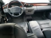 ✅ 2001 Cadillac DeVille Funeral Coach • VIN: 1GEEH90Y31U500972 • Лот: 45454015. Опубликован ранее на Copart с пробегом 79 482 миль. Бесплатный доступ к архиву аукционных продаж из США и подробный отчёт об истории автомобиля на DreamBid. Изображение 8.