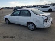 ✅ 2001 Toyota Corolla CE • VIN: 1NXBR12E71Z517721 • Lot: 80364505. Listed on Copart with 81,616 mi. Free auction sales archive from the USA and detailed vehicle history report at DreamBid. Image 2.