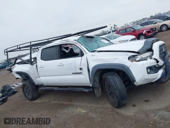 ✅ 2019 Toyota Tacoma SR5 • VIN: 3TMDZ5BN0KM069526 • Lot: 41911650. Listed on IAAI with 104,430 mi. Free auction sales archive from the USA and detailed vehicle history report at DreamBid. Image 13.