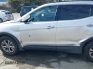 ✅ 2014 Hyundai Santa Fe • VIN: 5XYZU3LB7EG205102 • Lot: 43657537. Wystawiony na IAAI z przebiegiem 142 689 mil. Bezpłatny archiwum sprzedaży aukcyjnych z USA i szczegółowy raport historii pojazdu na DreamBid. Zdjęcie 6.