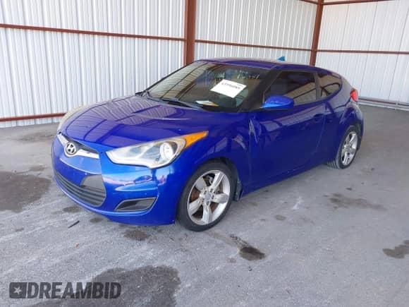 2012 Hyundai Veloster w/Red Int with VIN KMHTC6AD1CU042131, listed as a IAAI auction lot 43596089 with 161,968 mi miles and . Bid and sale history available at DreamBid. Image 2.