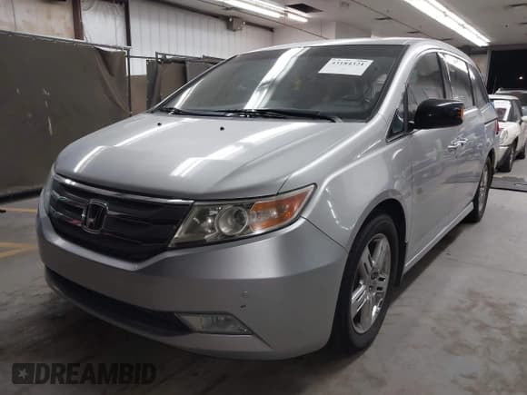 ✅ 2012 Honda Odyssey Touring • VIN: 5FNRL5H90CB004537 • Lot: 43184321. Listed on IAAI with 132,469 mi. Free auction sales archive from the USA and detailed vehicle history report at DreamBid. Image 2.